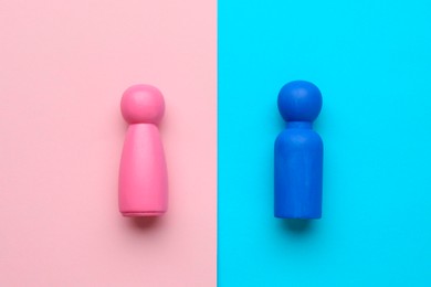 Gender equality concept. Male and female figures on color background, flat lay