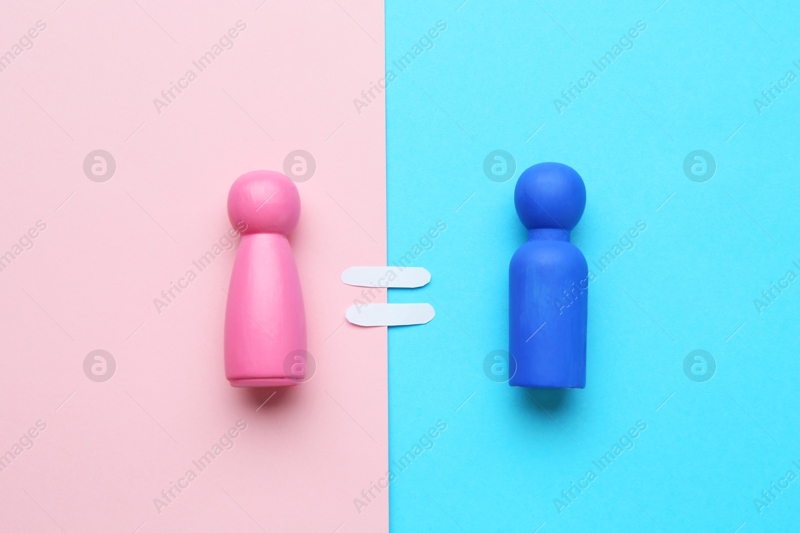 Photo of Gender equality concept. Male and female figures on color background, flat lay