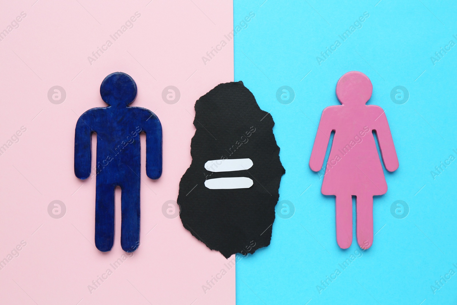 Photo of Gender equality concept. Male and female figures on color background, flat lay