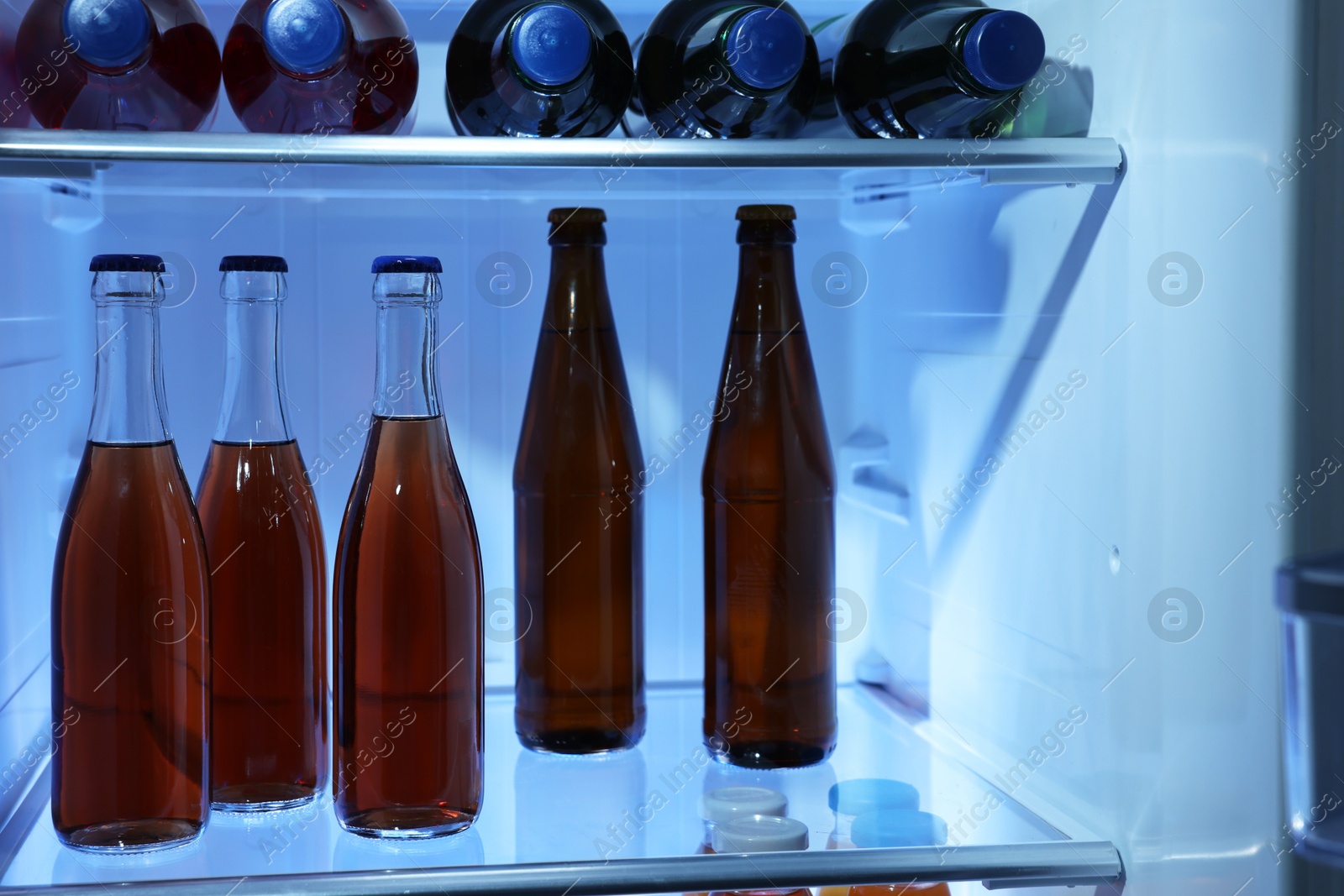 Photo of Many different cold drinks in refrigerator, closeup