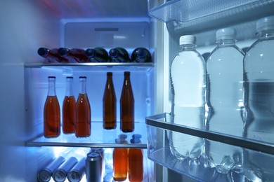 Many different cold drinks in refrigerator, closeup