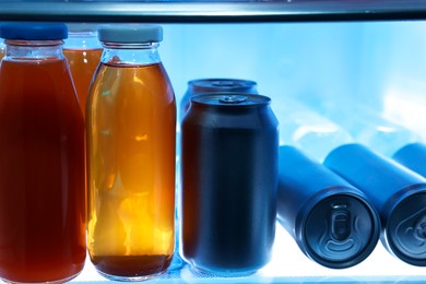 Many different cold drinks in refrigerator, closeup