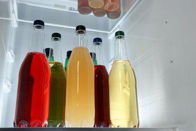 Many different cold drinks in refrigerator, low angle view