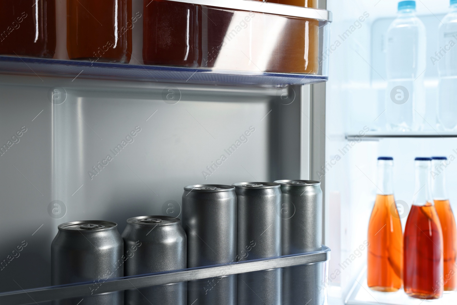 Photo of Many different cold drinks in refrigerator, closeup