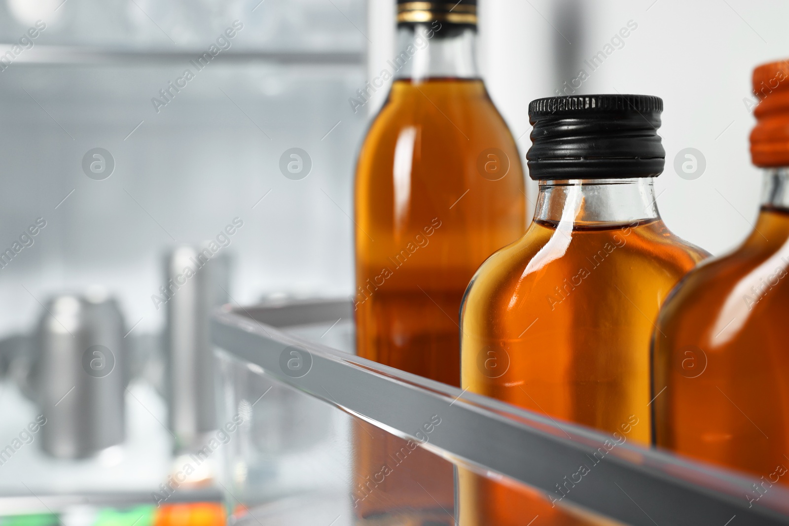 Photo of Many different cold drinks in refrigerator, closeup. Space for text