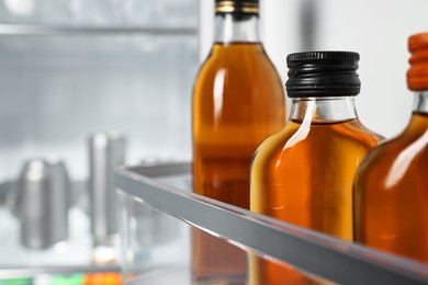 Many different cold drinks in refrigerator, closeup. Space for text