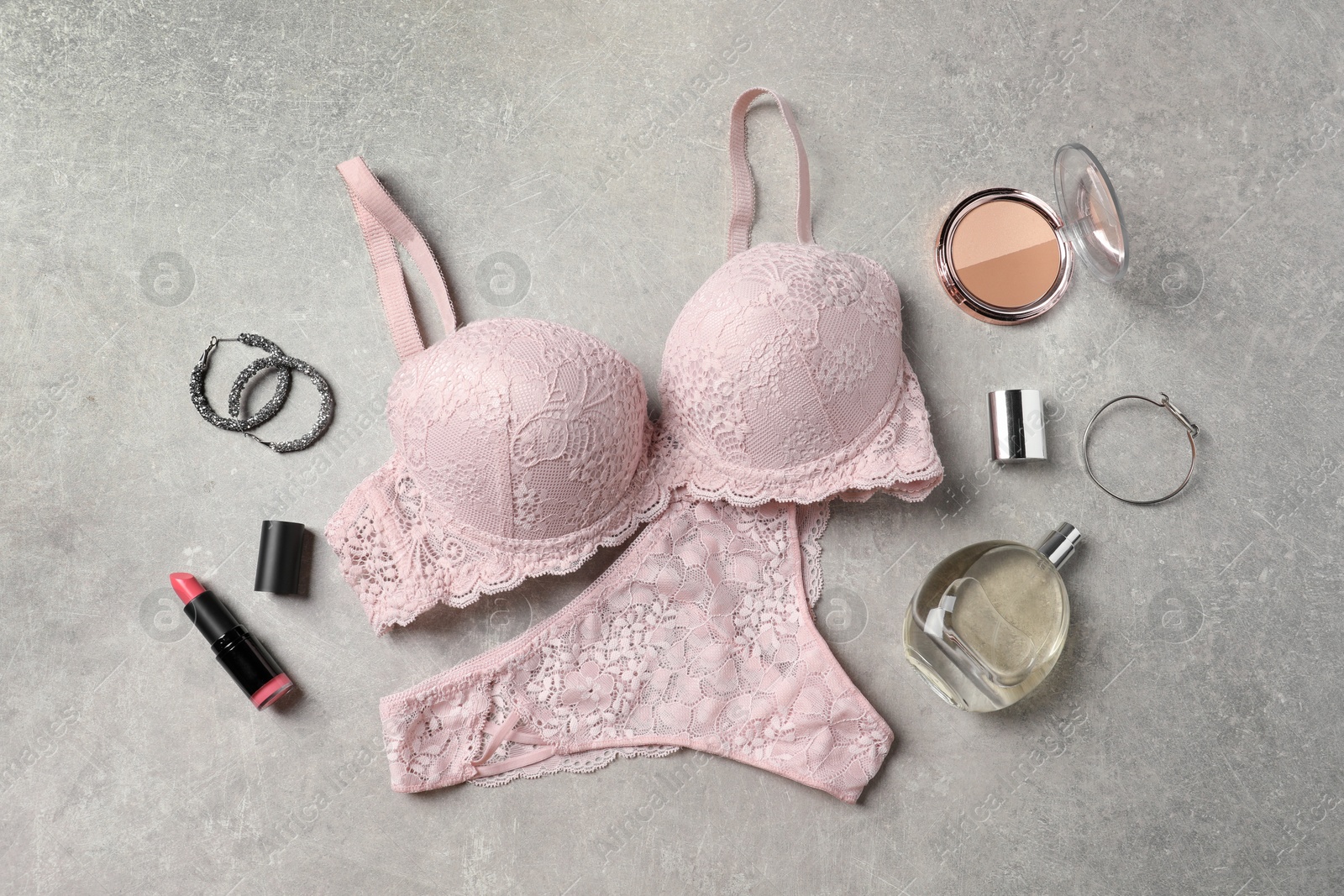 Photo of Beautiful lace lingerie and accessories on grey background, flat lay