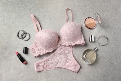 Photo of Beautiful lace lingerie and accessories on grey background, flat lay