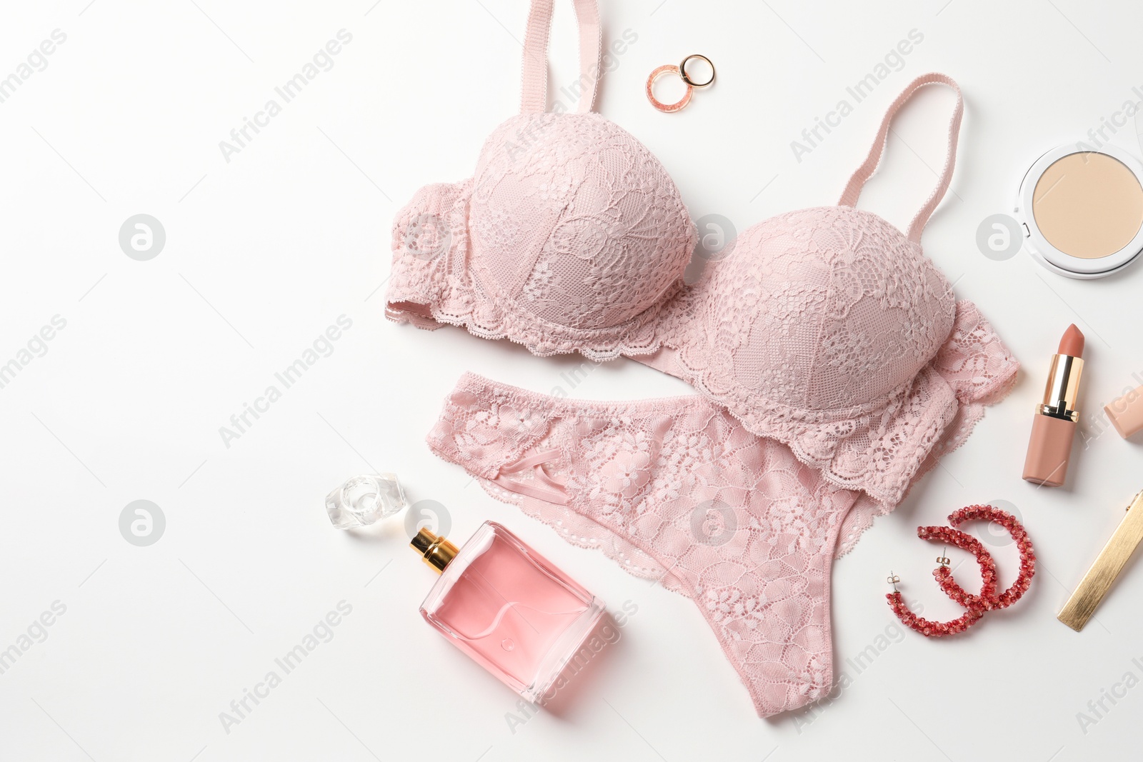 Photo of Beautiful lace lingerie and accessories on white background, flat lay