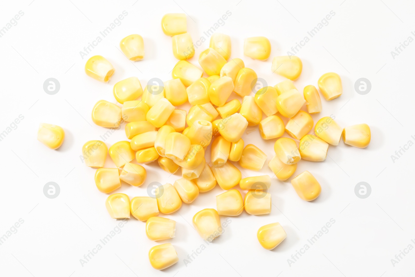 Photo of Pile of fresh corn kernels on white background, flat lay