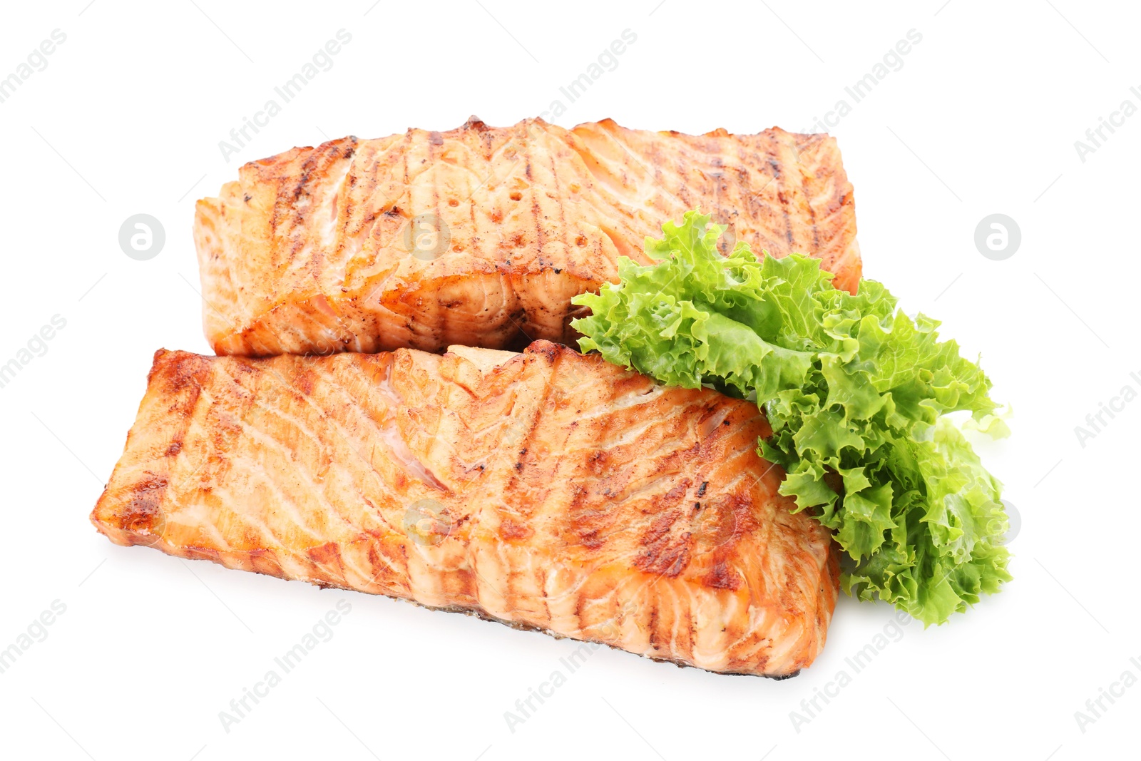 Photo of Delicious grilled salmon fillets with lettuce isolated on white