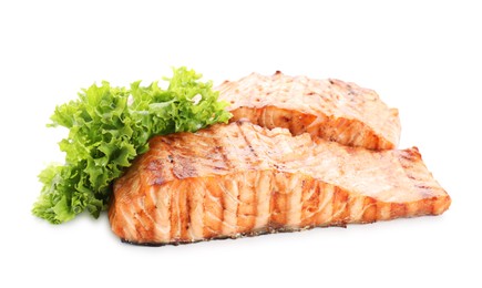 Photo of Delicious grilled salmon fillets with lettuce isolated on white