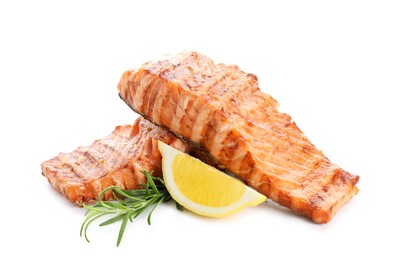 Photo of Delicious grilled salmon fillets with lemon and rosemary isolated on white