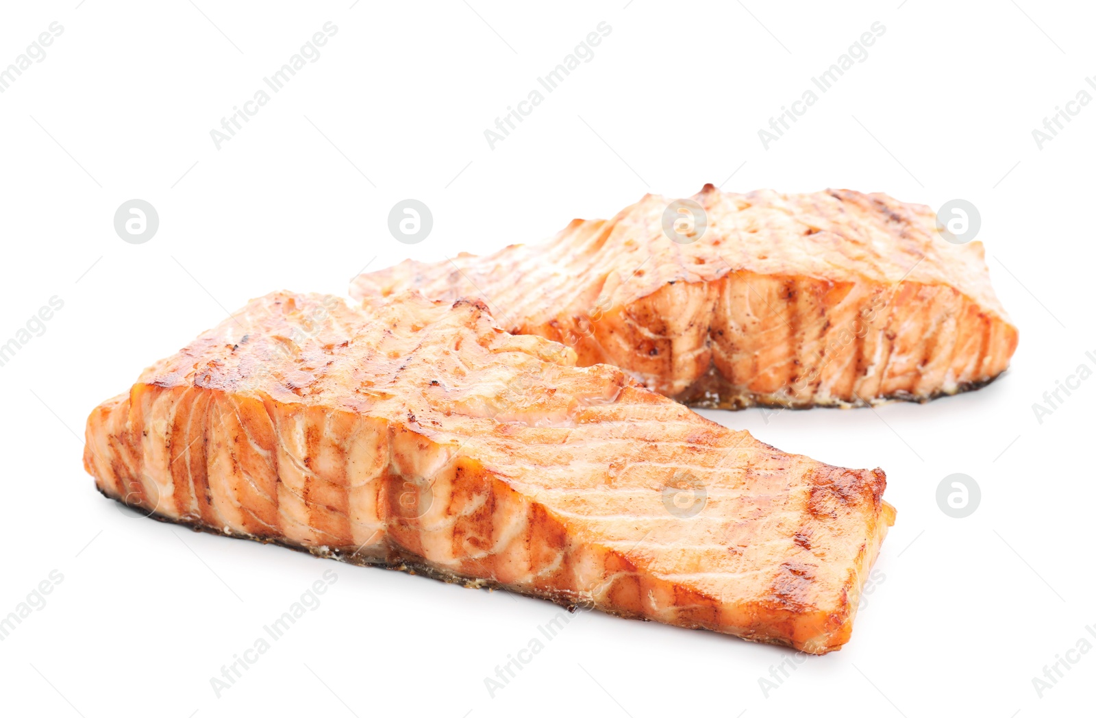 Photo of Delicious grilled salmon fillets isolated on white