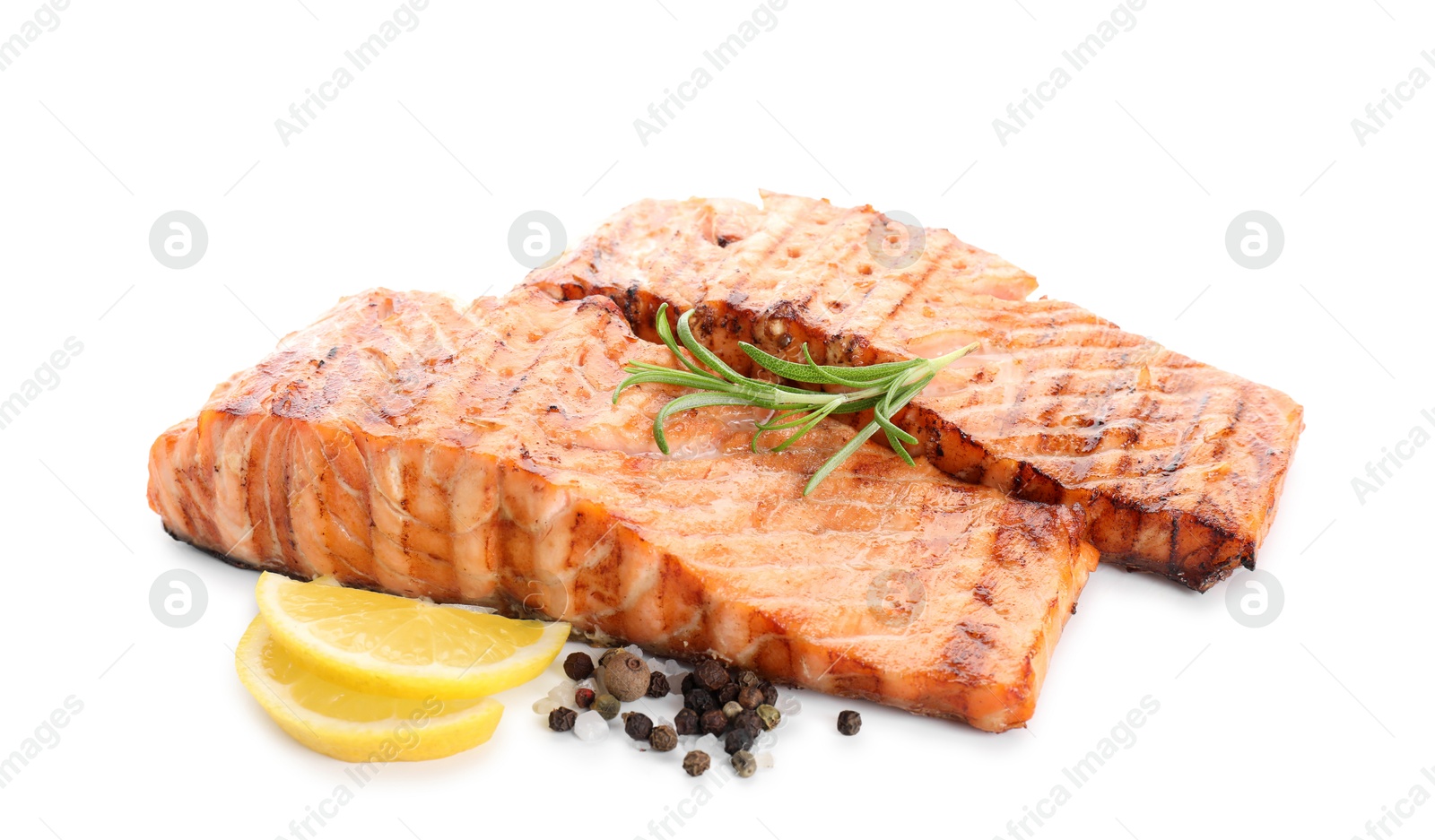 Photo of Delicious grilled salmon fillets with peppercorns, lemon and rosemary isolated on white