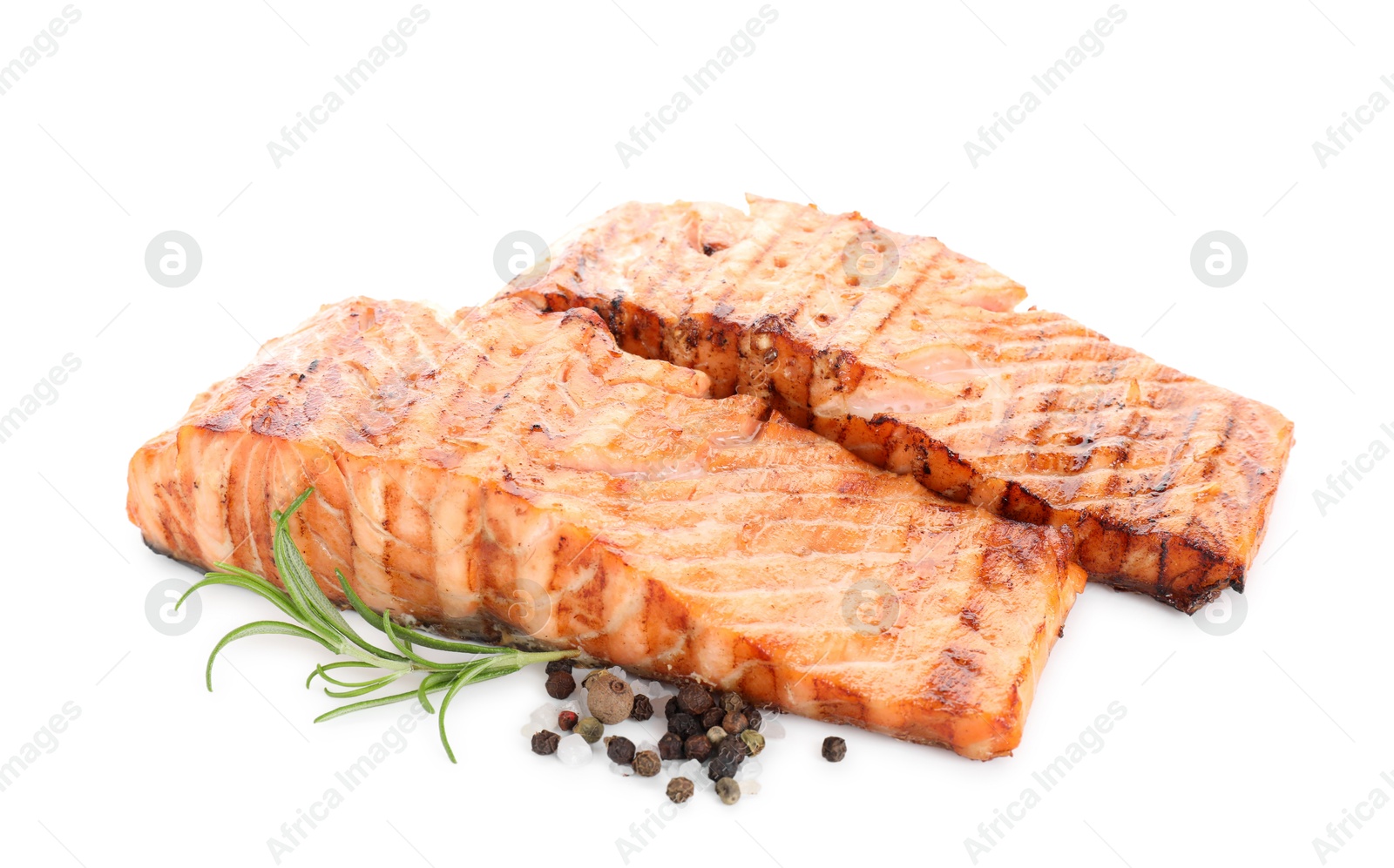 Photo of Delicious grilled salmon fillets with peppercorns and rosemary isolated on white