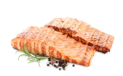 Photo of Delicious grilled salmon fillets with peppercorns and rosemary isolated on white