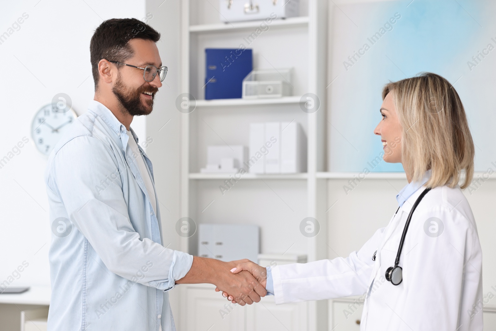 Photo of Doctor shaking hands with patient in hospital