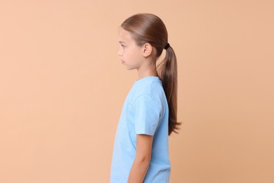 Photo of Girl with correct posture on beige background