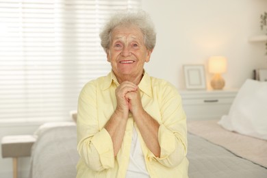 Photo of Portrait of smiling senior woman at home