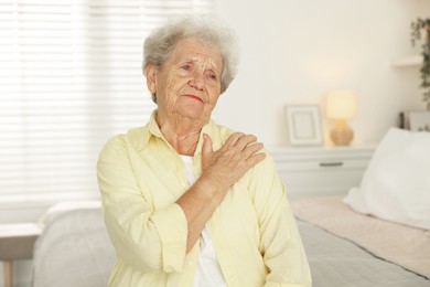 Portrait of sad senior woman at home