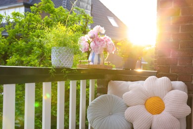 Balcony garden. Different plants growing on railings outdoors