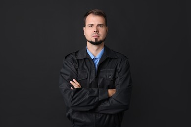 Security guard in uniform on black background