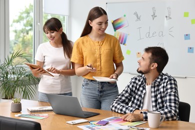 Group of designers working together in office