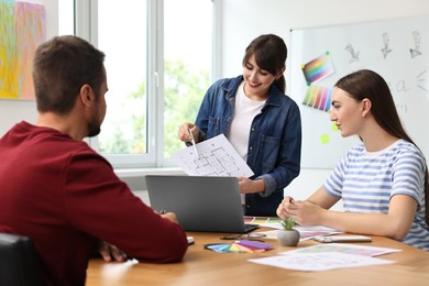 Group of designers working together in office