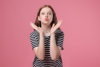 Photo of Portrait of teenage girl on pink background