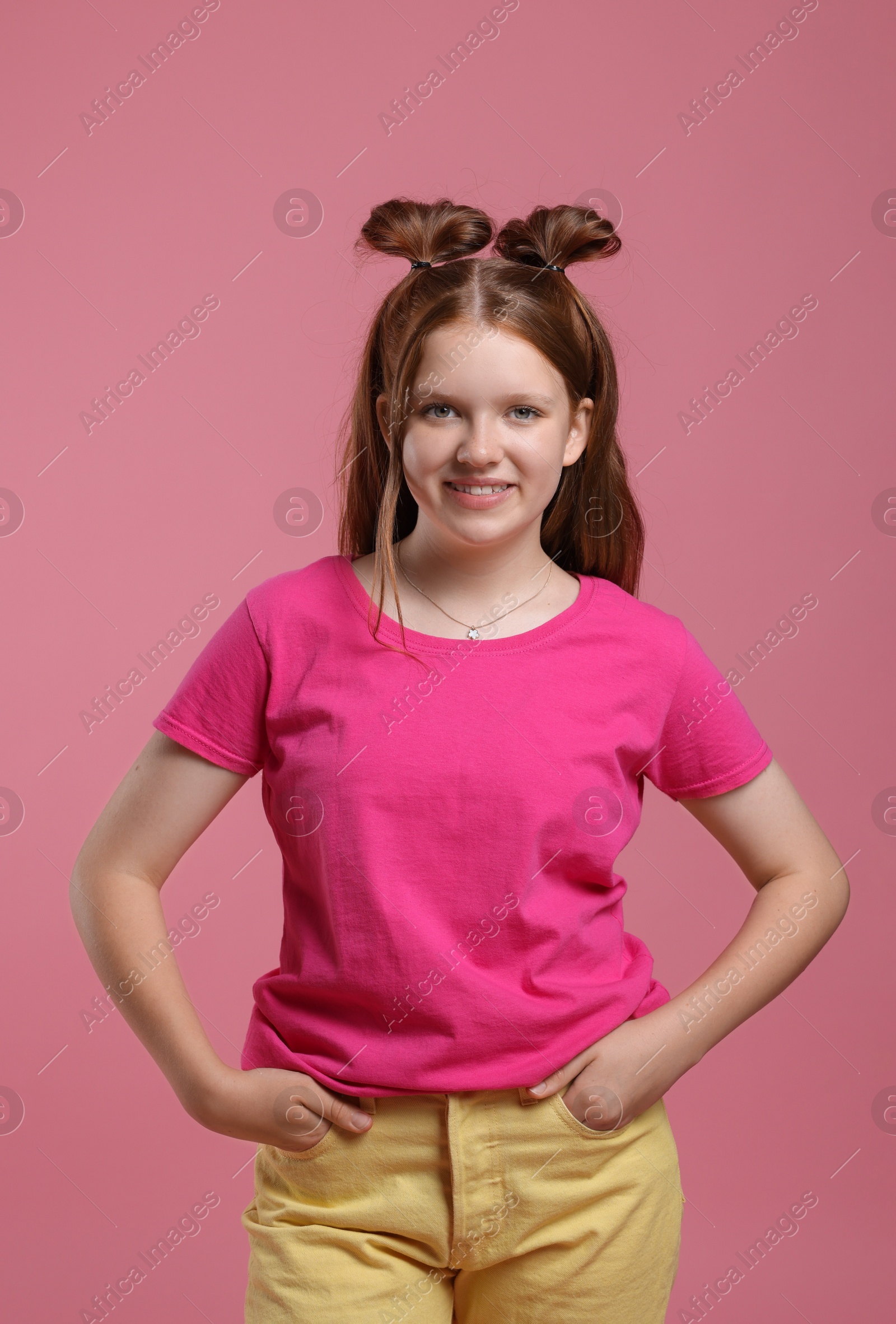 Photo of Portrait of teenage girl on pink background