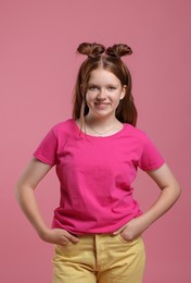 Portrait of teenage girl on pink background