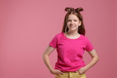 Photo of Portrait of teenage girl on pink background, space for text