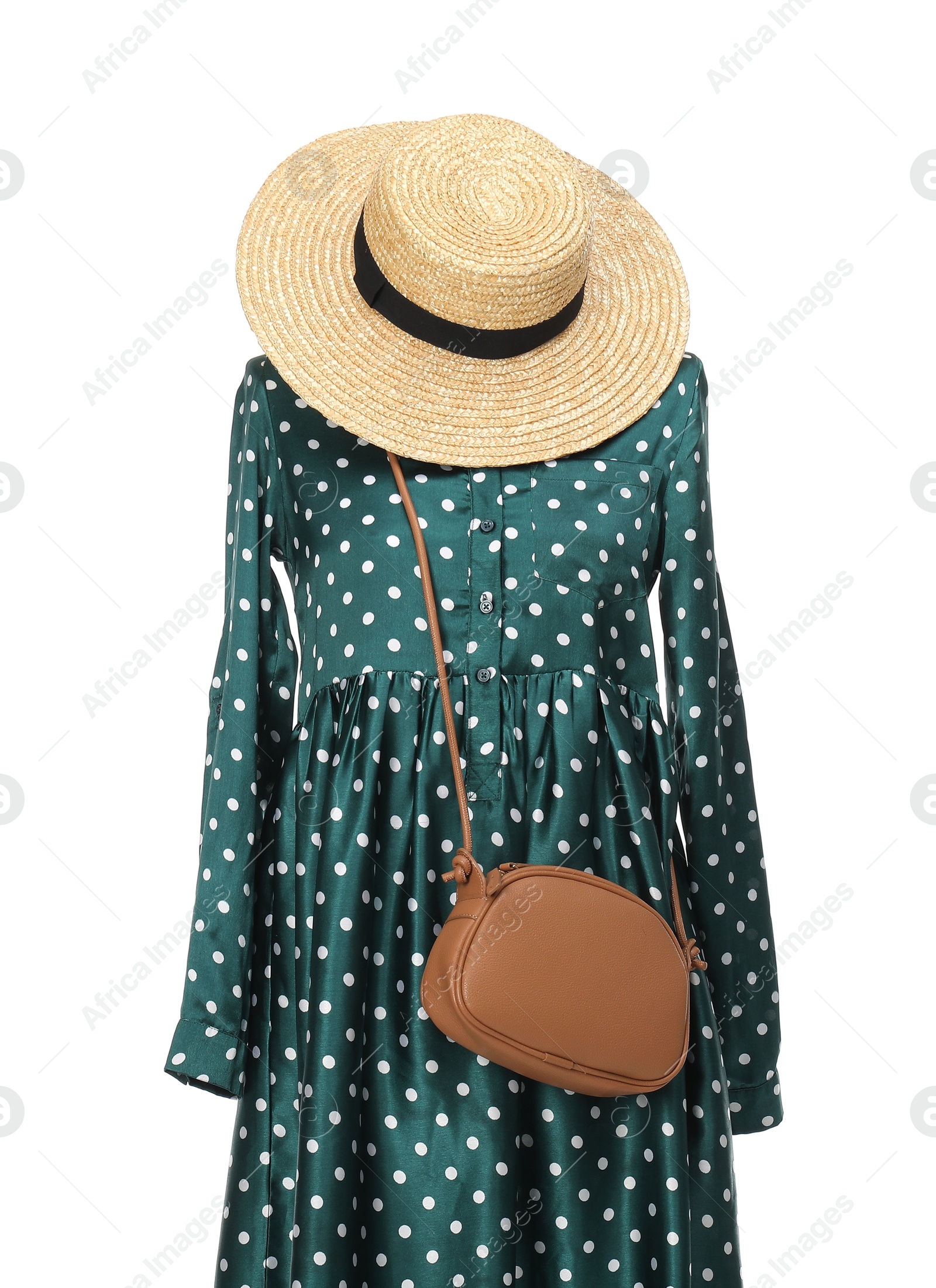 Photo of Mannequin with new stylish dress, bag and wicker hat isolated on white