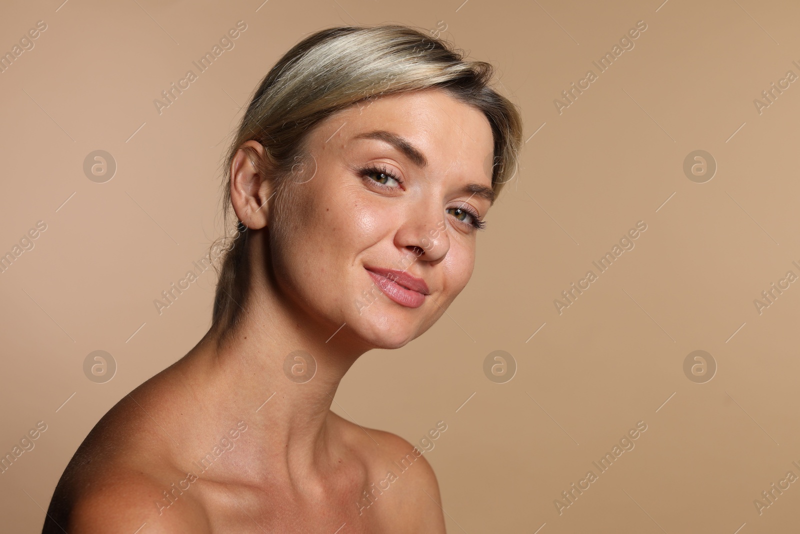 Photo of Cosmetology. Beautiful woman with perfect skin on beige background, space for text