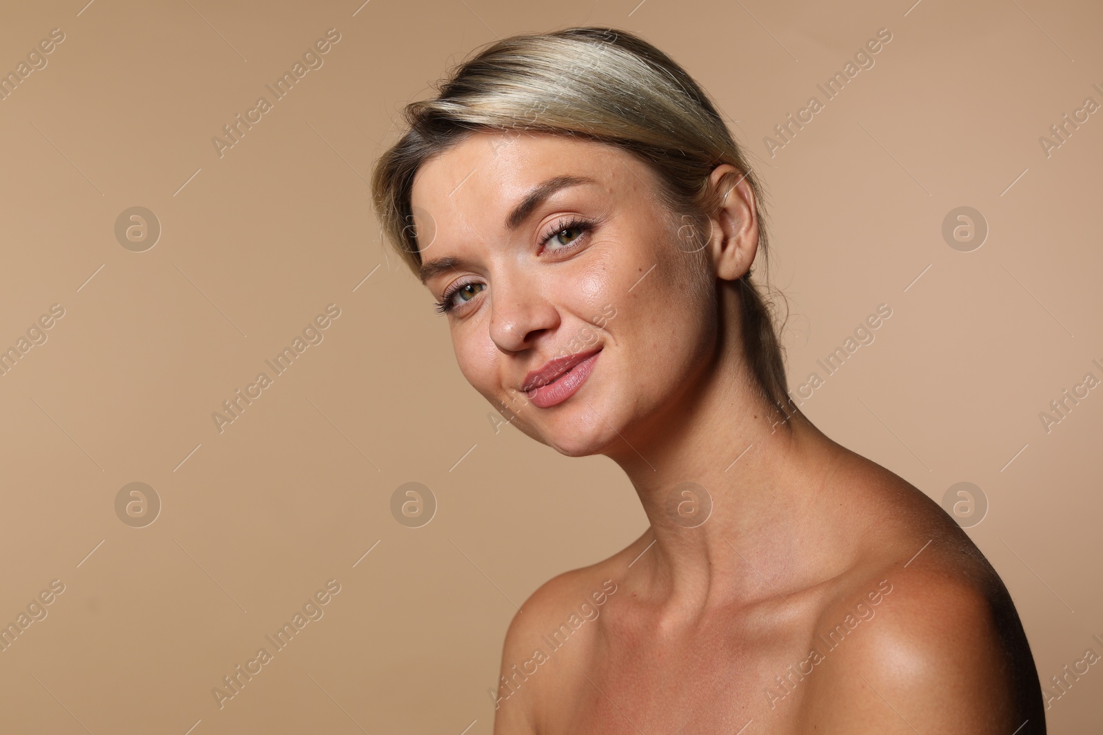 Photo of Cosmetology. Beautiful woman with perfect skin on beige background, space for text