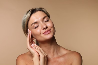 Photo of Cosmetology. Beautiful woman with perfect skin on beige background