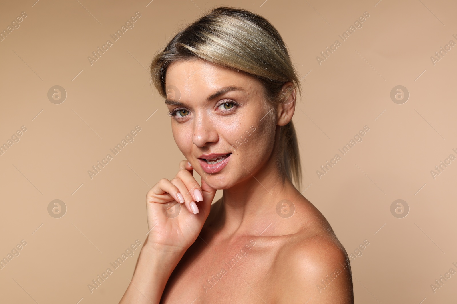 Photo of Cosmetology. Beautiful woman with perfect skin on beige background