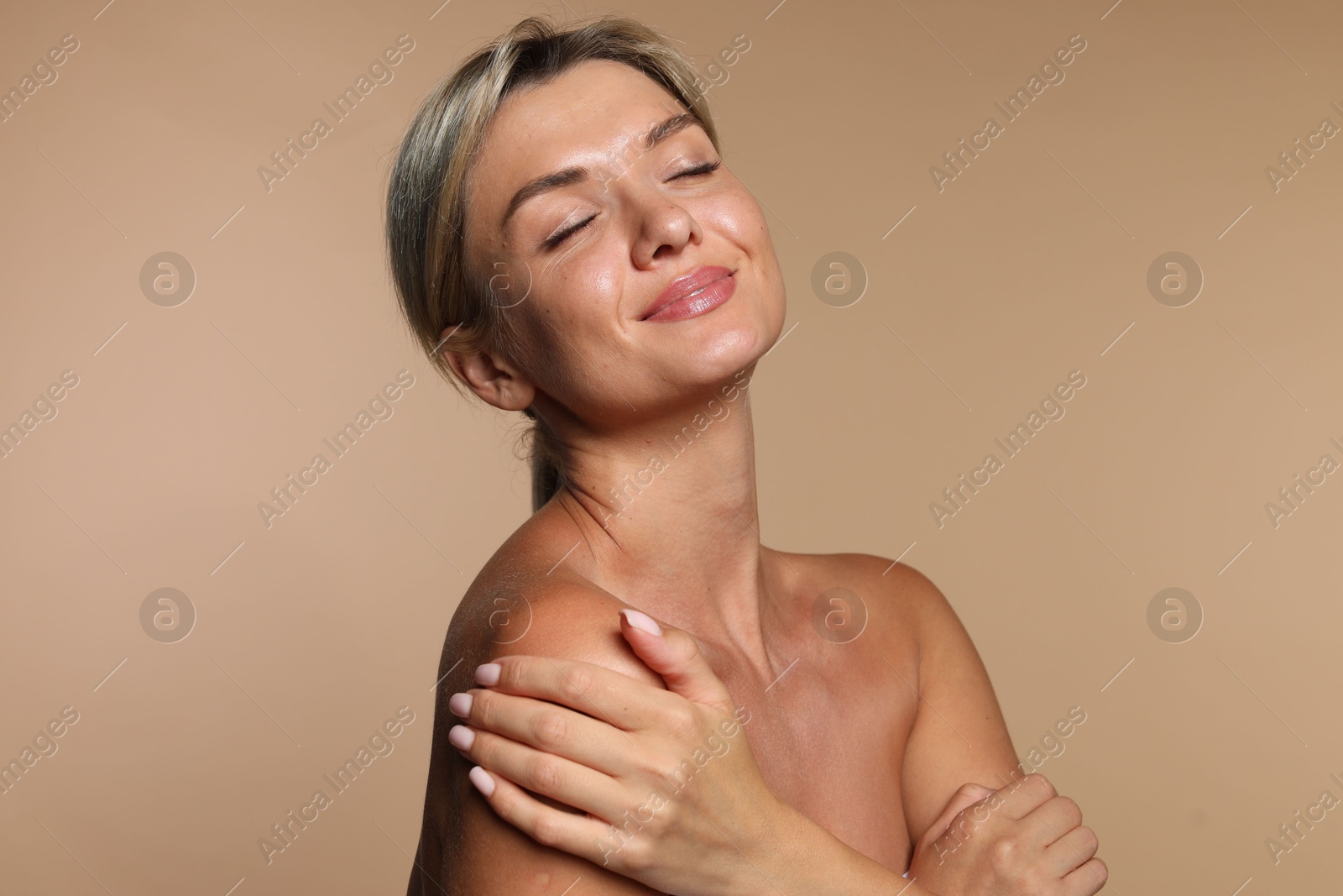 Photo of Cosmetology. Beautiful woman with perfect skin on beige background