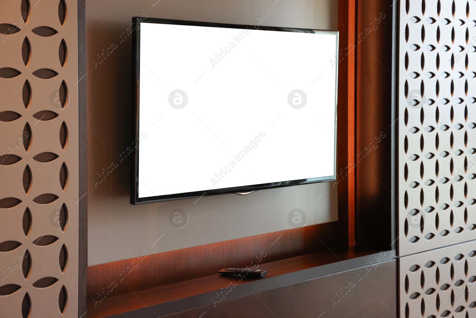 Photo of Tv set mounted on wall in room