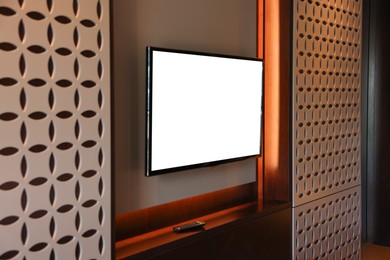 Photo of Tv set mounted on wall in room