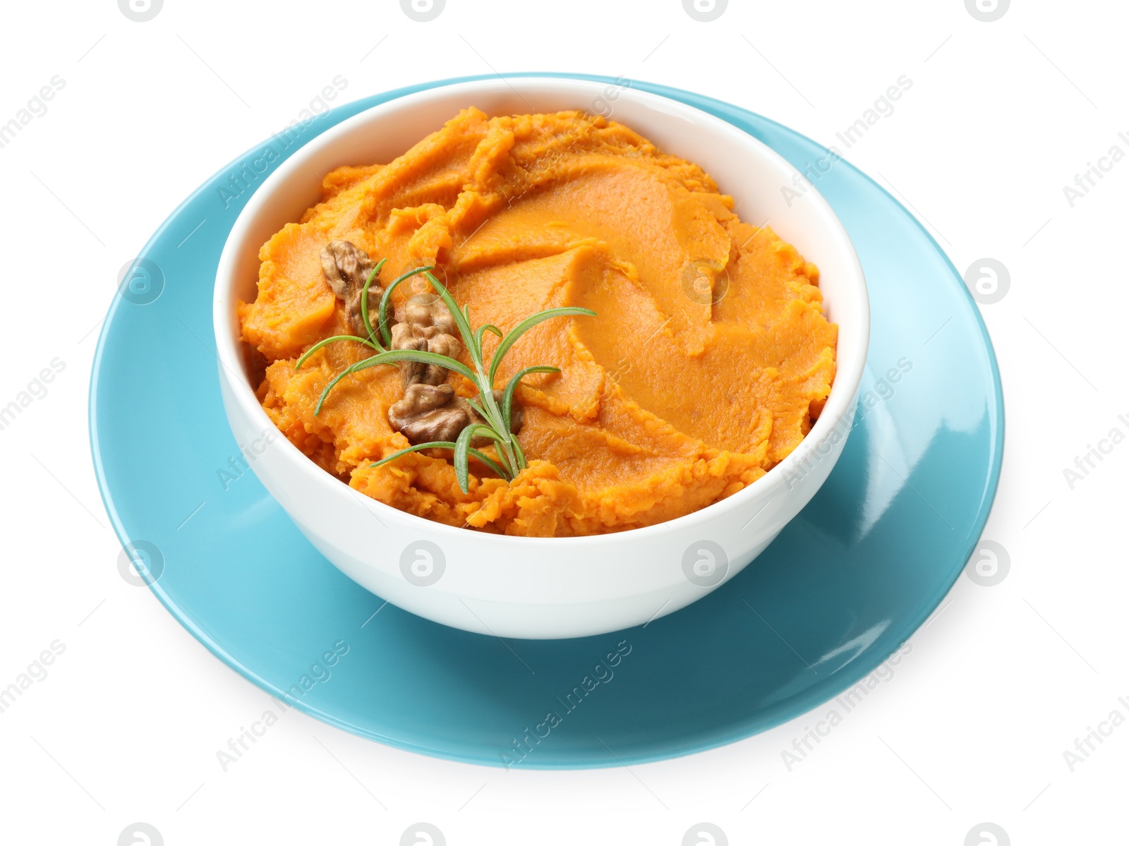 Photo of Delicious mashed sweet potatoes with walnuts and rosemary in bowl isolated on white