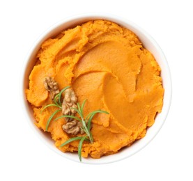 Photo of Delicious mashed sweet potatoes with walnuts and rosemary in bowl isolated on white, top view