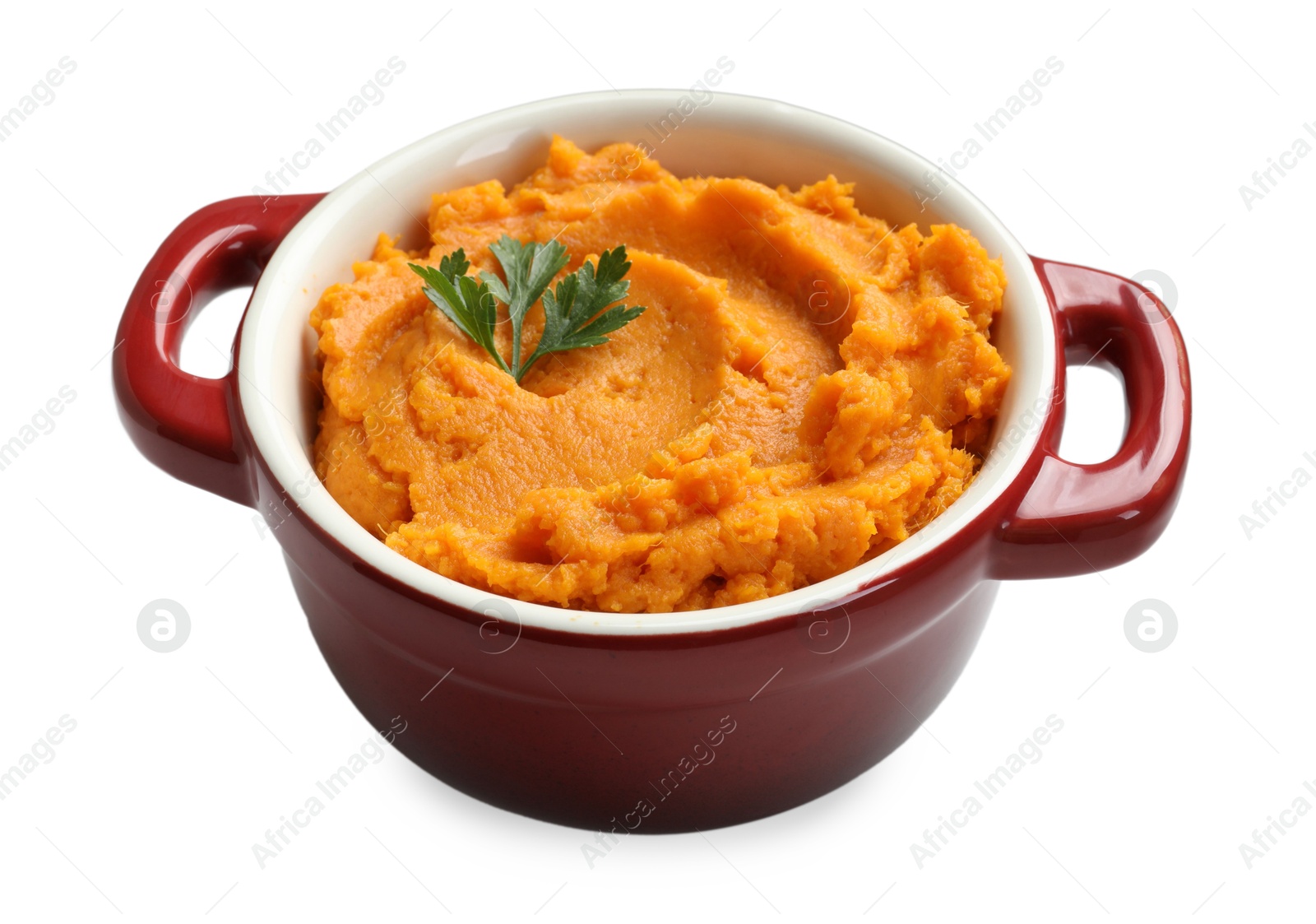 Photo of Delicious mashed sweet potatoes with parsley in pot isolated on white