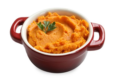 Photo of Delicious mashed sweet potatoes with parsley in pot isolated on white