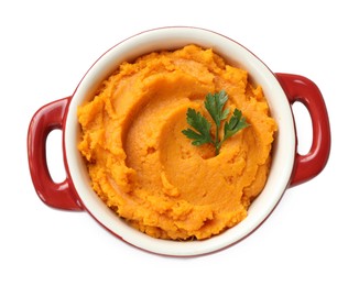 Photo of Delicious mashed sweet potatoes with parsley in pot isolated on white, top view