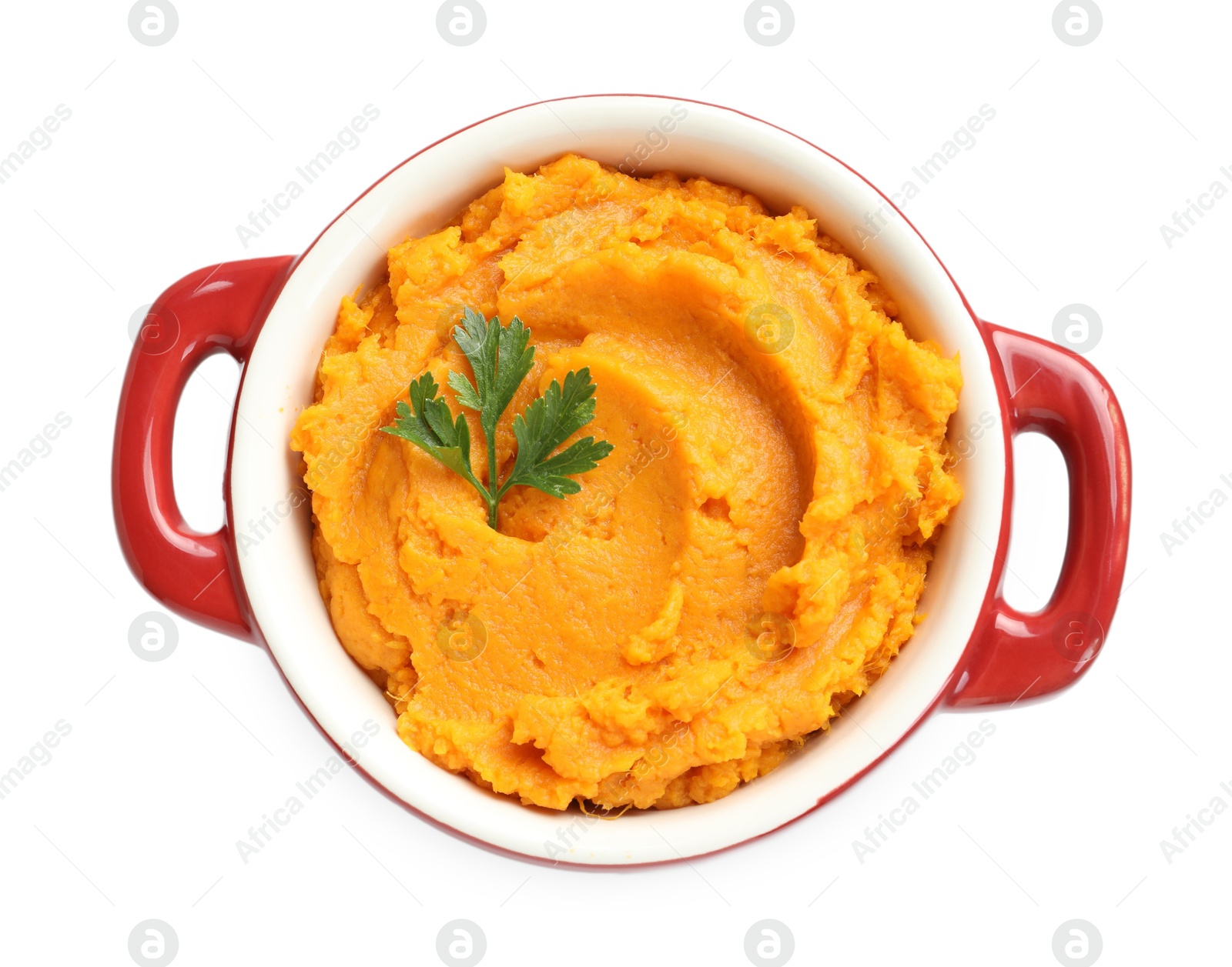 Photo of Delicious mashed sweet potatoes with parsley in pot isolated on white, top view