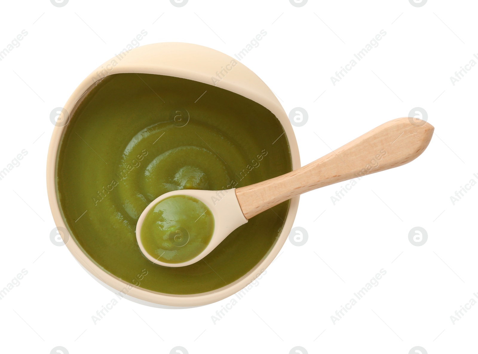 Photo of Tasty baby food in bowl and spoon isolated on white, top view