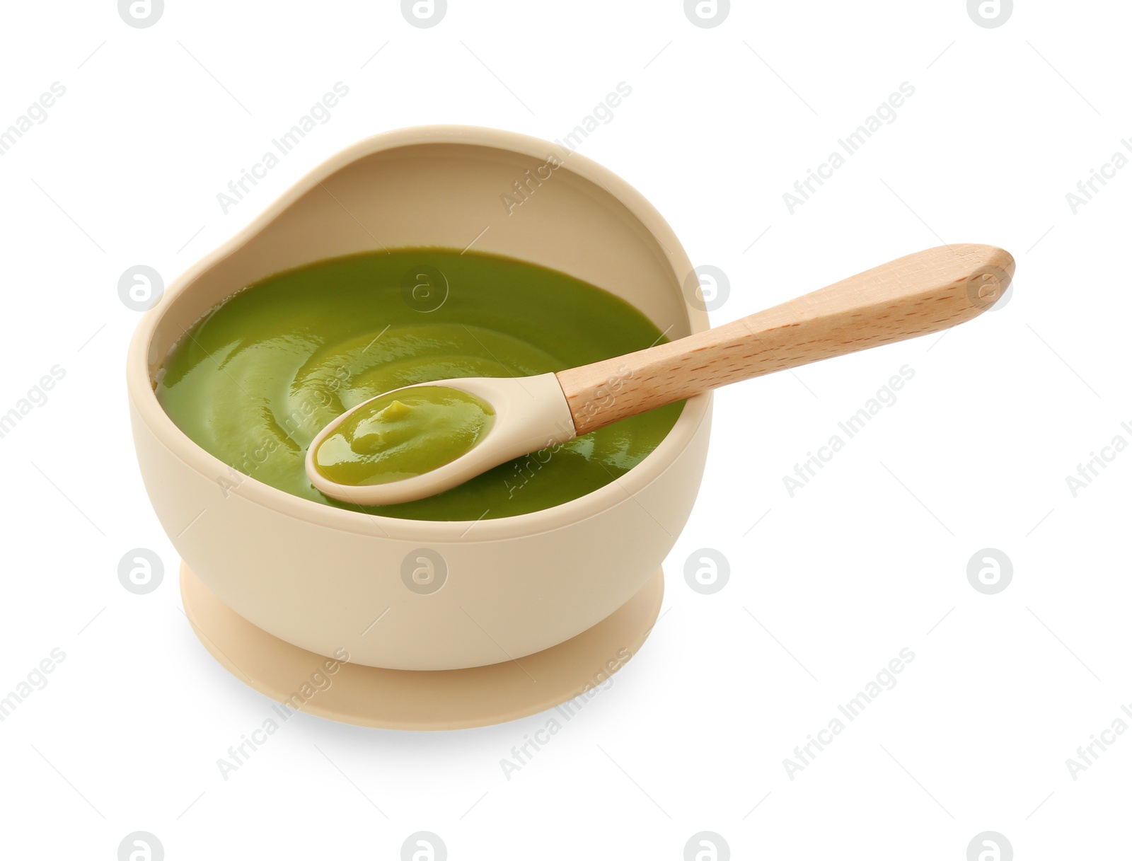 Photo of Tasty baby food in bowl and spoon isolated on white