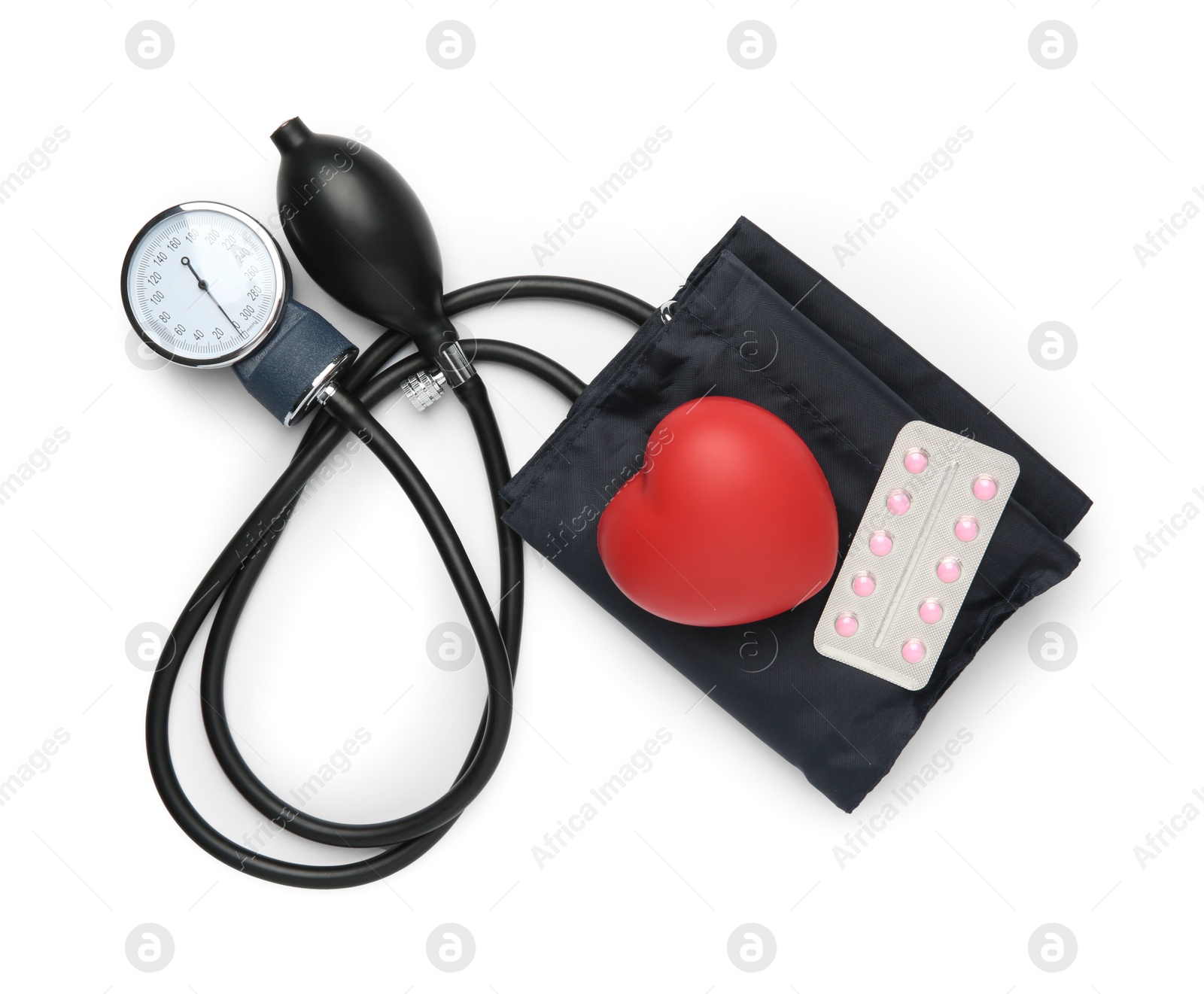 Photo of Blood pressure measuring device, pills in blister and red decorative heart isolated on white, top view